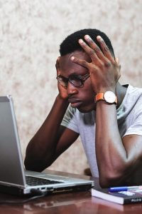 man stressed at computer