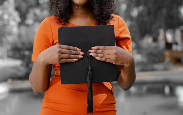 woman holding cap with tassel